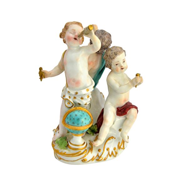 A Meissen group allegorical of Science, circa 1760-70, modelled as three putti on a scroll moulded base, one with a telescope and with a globe at his