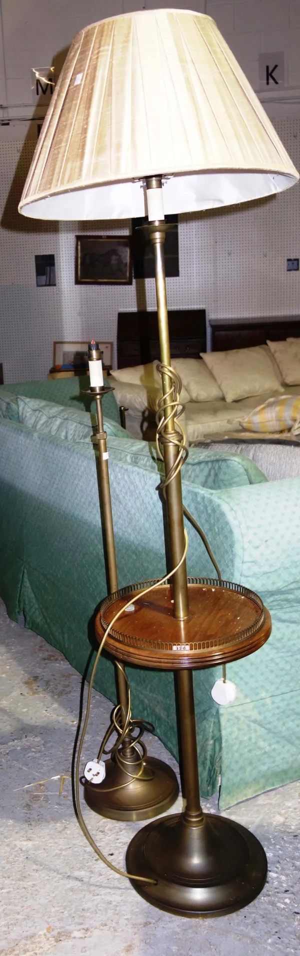 A 20th century brass adjustable floor lamp together with another with galleried top. (2)  M4