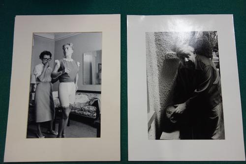 PHOTOGRAPHS - Joan Crawford, full length in domestic setting & having a fitting (with dresser behind), b/w., 15 x 10 ins. (approx.); pencilled on vers