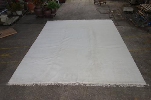 A large modern white Liberty of London carpet.  Extra