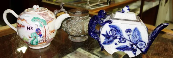 A 19th century Chinese style cream teapot together with a blue and white floral teapot and a thai brass teapot, (3).  CAB