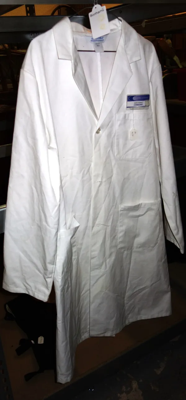 Movie Costumes; a white doctors coat with name plaque, James Hosking consultant Courtnell Hospital and a black footed lycra ribbed leotard/suit.