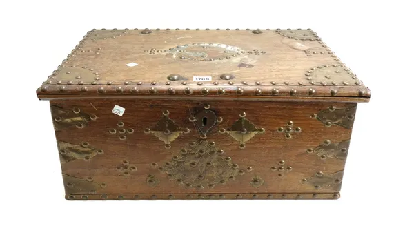 A 19th century Zanzibar teak and brass studded table top box, with part fitted interior and twin carrying handles to the sides, 55cm wide.  Provenance