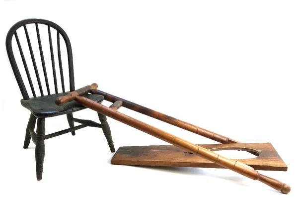 A 19th century painted child's stick back chair, together with a beech and oak boot jack with turned decoration (2).