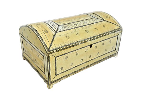 An early 19th century Anglo Indian/Vizagapatam penwork ivory veneered sandalwood dome top casket, on bracket feet, 44cm wide x 22cm high.  Illustrated