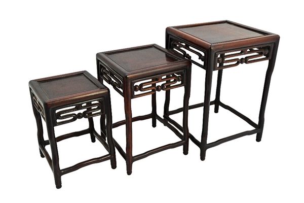 A nest of three Chinese early 20th century hardwood square tables, with pierced frieze on in-stepped turned supports, the larger 21cm wide.  Illustrat