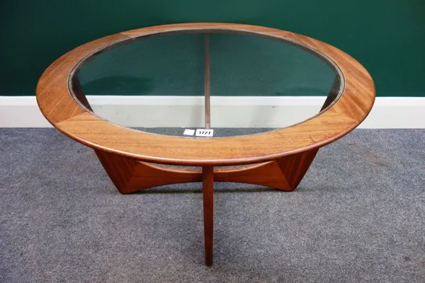 A 20th century G plan teak and glass inset coffee table, on four shaped supports, 84cm wide.