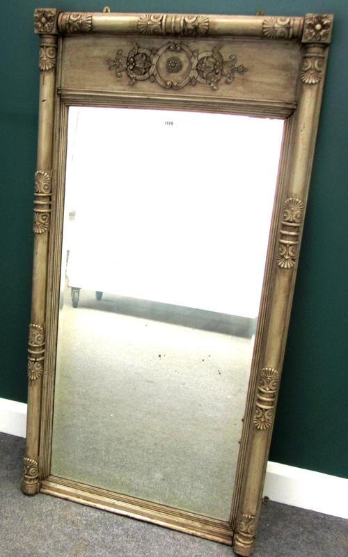 A William IV and later green painted wall mirror, with carved column decoration and bevelled mirror plate, 79cm wide x 155cm high.