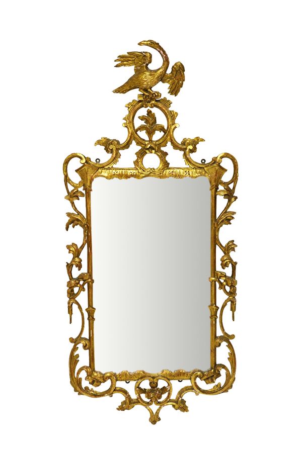 A George III gilt framed wall mirror, with Ho-ho bird crest over pierced and carved frame and floral lower frieze, 66cm wide x 140cm high.     Illustr
