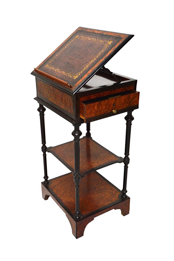 'MAISON GIROUX PARIS',  a mid 19th century amboyna and rosewood reading table, the rotating top with angle adjustment reading surface, over two open t