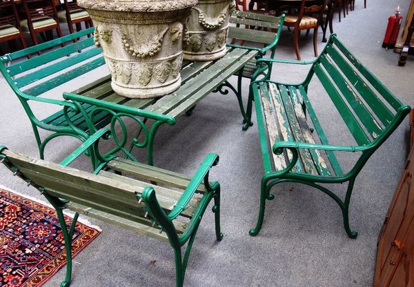 A suite of green painted metal garden furniture of Art Nouveau design, to comprise; a table, 125cm x 71cm, two benches, each 120cm wide, and two armch