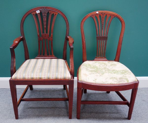 A matched set of twelve 19th century Hepplewhite style dining chairs, each with pierced splat and straight front seat, on tapering square supports, to