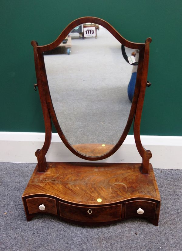 A George III tulipwood banded mahogany toilet mirror, with shield shaped plate over a three drawer serpentine base, 42cm wide.