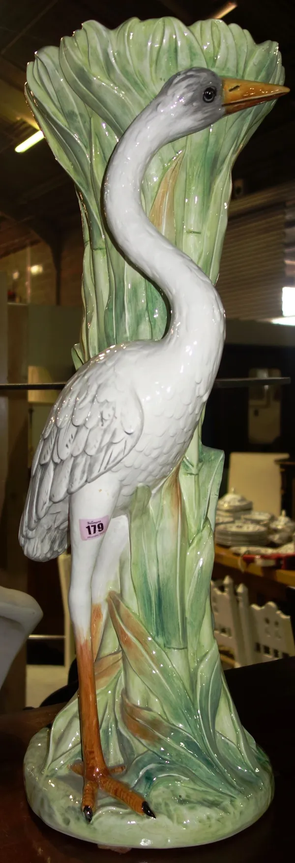 A modern pottery jardiniere stand modelled with a heron, 77cm high,   H5