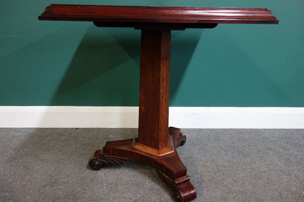 A William IV mahogany and rosewood games table, the marble inset square chessboard top on canted triangular column and three scroll feet, 65cm wide.