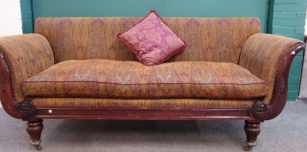 A William IV and later rosewood sofa, with outswept arms and straight front seat, on gilt metal capped inverted tulip carved supports, 215cm wide.