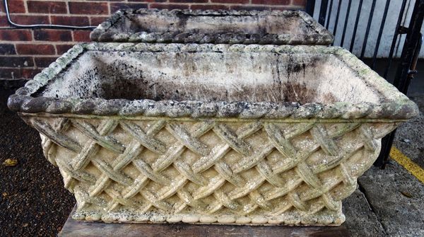 A pair of composite stone planters, each with lattice work tapering rectangular bodies, 94cm wide (2).