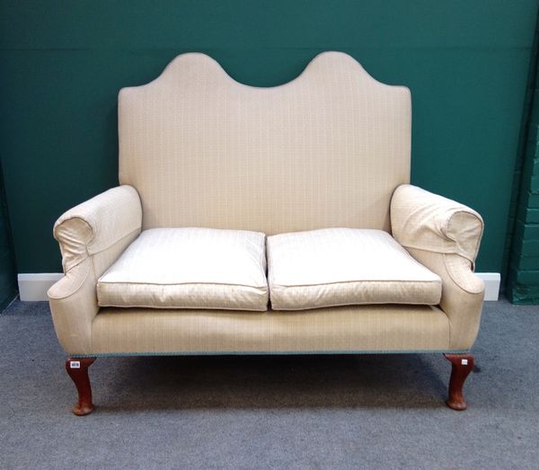 A Queen Anne style double hump back sofa, with outswept arms on squat cabriole supports, 148cm wide.