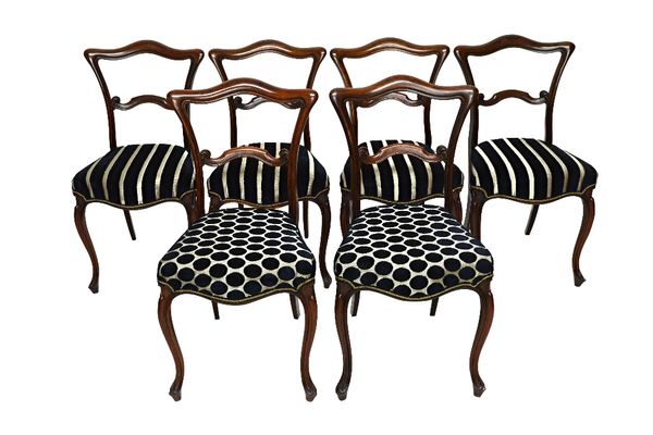 A set of six mid-19th century rosewood framed dining chairs, with shaped crest and waist rail over serpentine seat, on cabriole supports (6).  Illustr