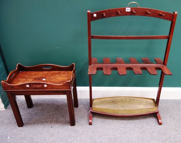 A 19th century mahogany boot and whip rack, 65cm wide, together with an 18th century mahogany tray top occasional table on later stand, 51cm wide.