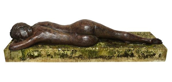 Diane Coates, 'Galatea', a life size bronze of a recumbent nude, on a rectangular stone plinth, 57cm wide x 150cm long.    Illustrated