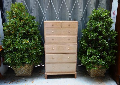 A set of four composite stone planters, each with lattice work tapering square body, planted with bay, the planters 45cm high (4).