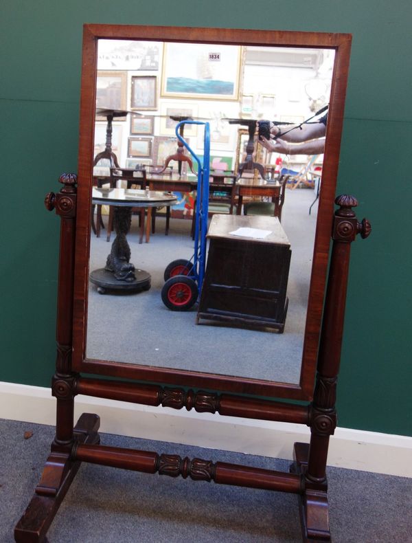 A William IV mahogany cheval mirror, with square plate, on lappet carved turned supports, 90cm wide.