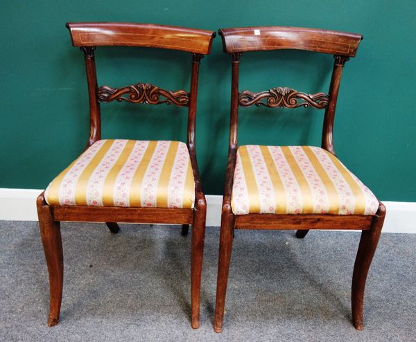 A set of six early Victorian inlaid rosewood dining chairs, with carved waist rail and sabre supports (6).