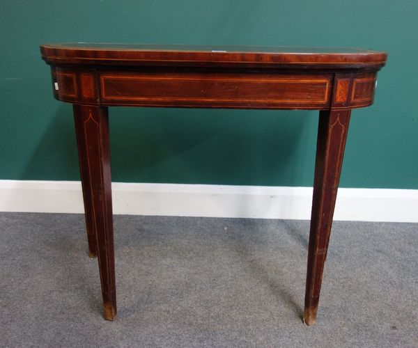 A late 18th century Scottish satinwood banded mahogany card table, the fold over D shape top on tapering square supports, 91cm wide.