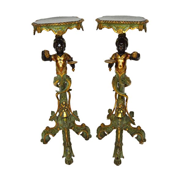 A pair of late 19th century parcel gilt polychrome painted jardinieres, modelled as standing Blackamoors, on carved tripod bases, 99cm high.    Illust