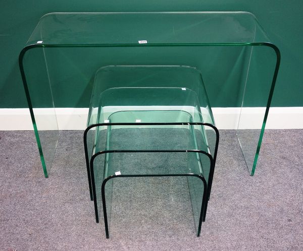 A nest of three 20th century moulded glass occasional tables, the largest 56cm wide, together with a matching console table, 106cm wide (4).