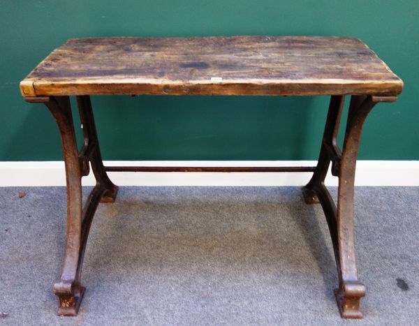 An early 20th century work/lathe bench, the rectangular oak top on a steel base, 115cm wide.