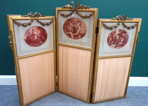 An early 20th century French gilt framed three fold screen, with ribbon and floral swag decoration, 141cm wide x 113cm high.