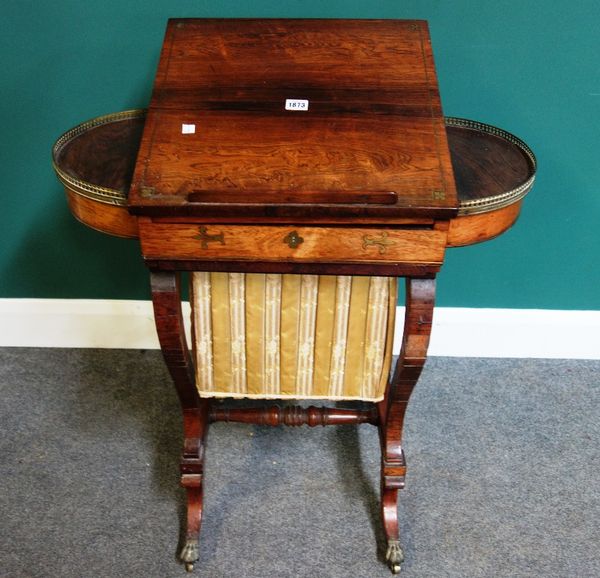 An early Victorian brass inlaid rosewood work table, with angle adjustable removable top flanked by fitted lift top compartments over wool box, on ope