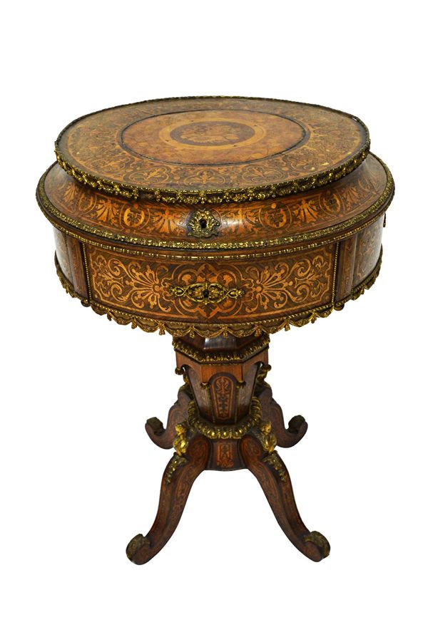 A 19th century French extensively marquetry inlaid gilt metal mounted Kingwood  drum top work table, with fitted interior over single drawer, on taper