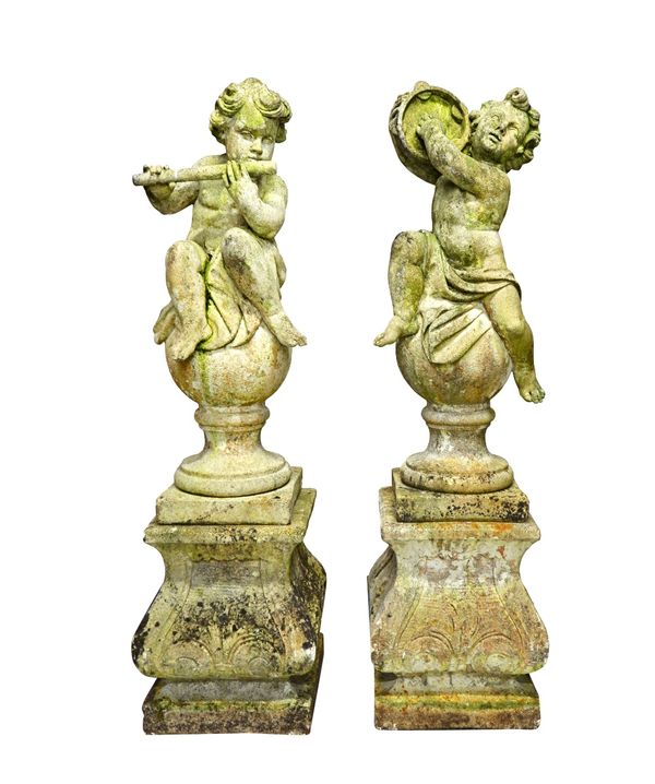 A set of four composition stone figures of cherubs playing instruments sat on a sphere, each on a shaped square plinth, 141cm high (4).    Illustrated