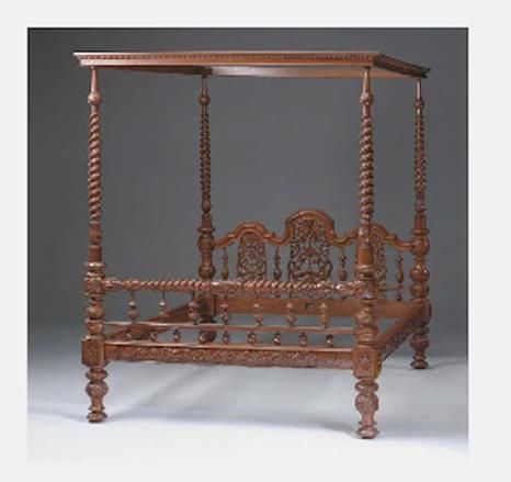 A 19th century Anglo Indian hardwood four poster bed, with pierced carved and turned head and foot boards, the canopy on spiral fluted supports, 83cm