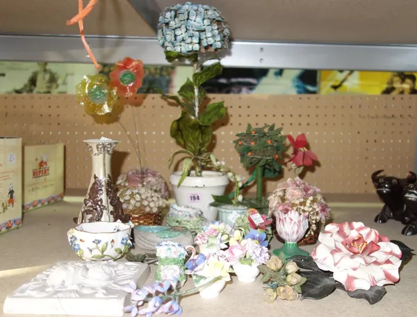 A quantity of mainly 20th century decorative flower and plant groups including porcelain, enamel and dried natural examples. (qty)  S1TProvenance; The