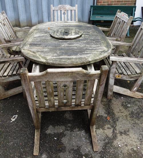 Forge Products, Hutton-Le-Hole, North Yorkshire; a hardwood oval garden table, 124cm wide x 196cm long, together with six matching armchairs (7).