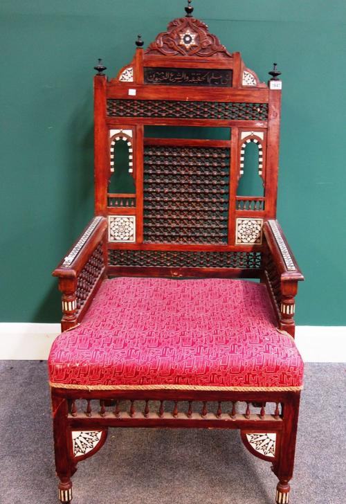 An early 20th century Moorish mother of pearl bone and bobbin turned decorated armchair.
