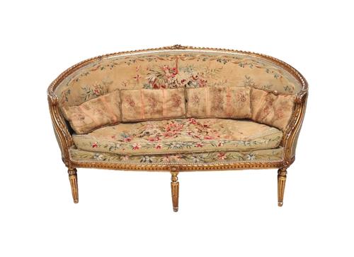 A French giltwood Aubusson upholstered salon suite late 19th/early 20th century, of Louis XVI design, to comprise; a sofa, 160cm wide and four fauteui