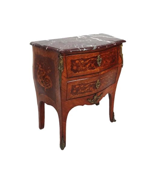 A Louis XV style petite commode, the shaped marble top over a gilt metal mounted marquetry inlaid rosewood bombe two drawer base on splayed supports,