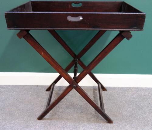 A George III and later mahogany butler's tray on folding X-frame stand, 75cm wide; together with a George II style parcel gilt mahogany small tripod t