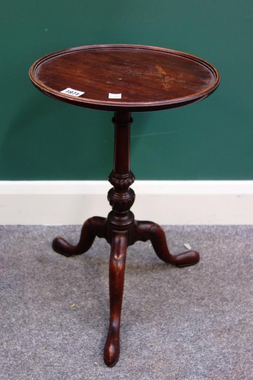 A small 19th century mahogany tripod table, with circular dish top on spiral fluted columns, on three downswept supports, 32cm wide.