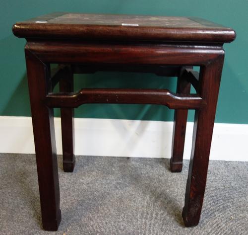 A late 19th century Chinese hardwood jardiniere stand with marble inset rectangular top on block supports united by shaped stretcher, 41cm wide.