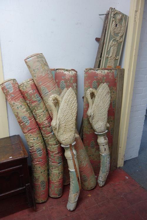 A 19th century North European polychrome painted show frame bed, on four splayed supports, with swan finials.