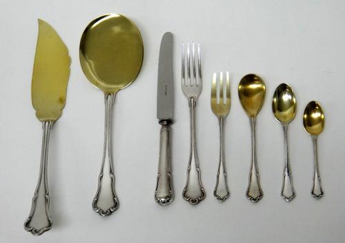 A German 800 Standard part table service, comprising; twelve dessert forks, twelve steel bladed cheese knives, the handles detailed 800, eighteen past