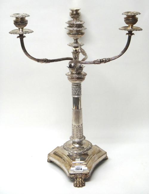 A silver plated French Empire style four light table candelabra, fitted with three scrolling arms and on a triform base, having three paw supports, he