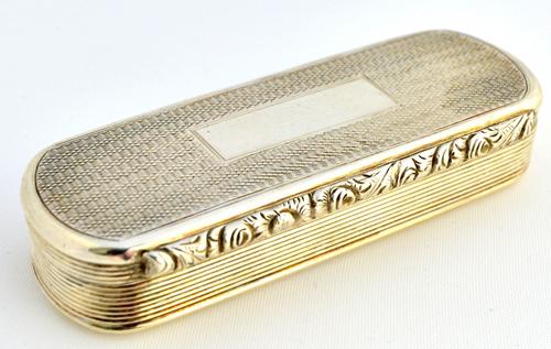 A William IV silver curved rectangular hinge lidded snuff box, the cover and the base engine turned, the sides reeded and with a floral moulded thumbp