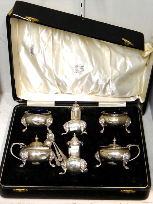 A silver six piece matched condiment set, comprising; two mustard pots, London 1937 and 1939, two salts, both London 1939 and two pepperettes, London